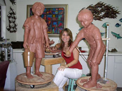 Cindy King sculpts in her Rain Barrel studio.